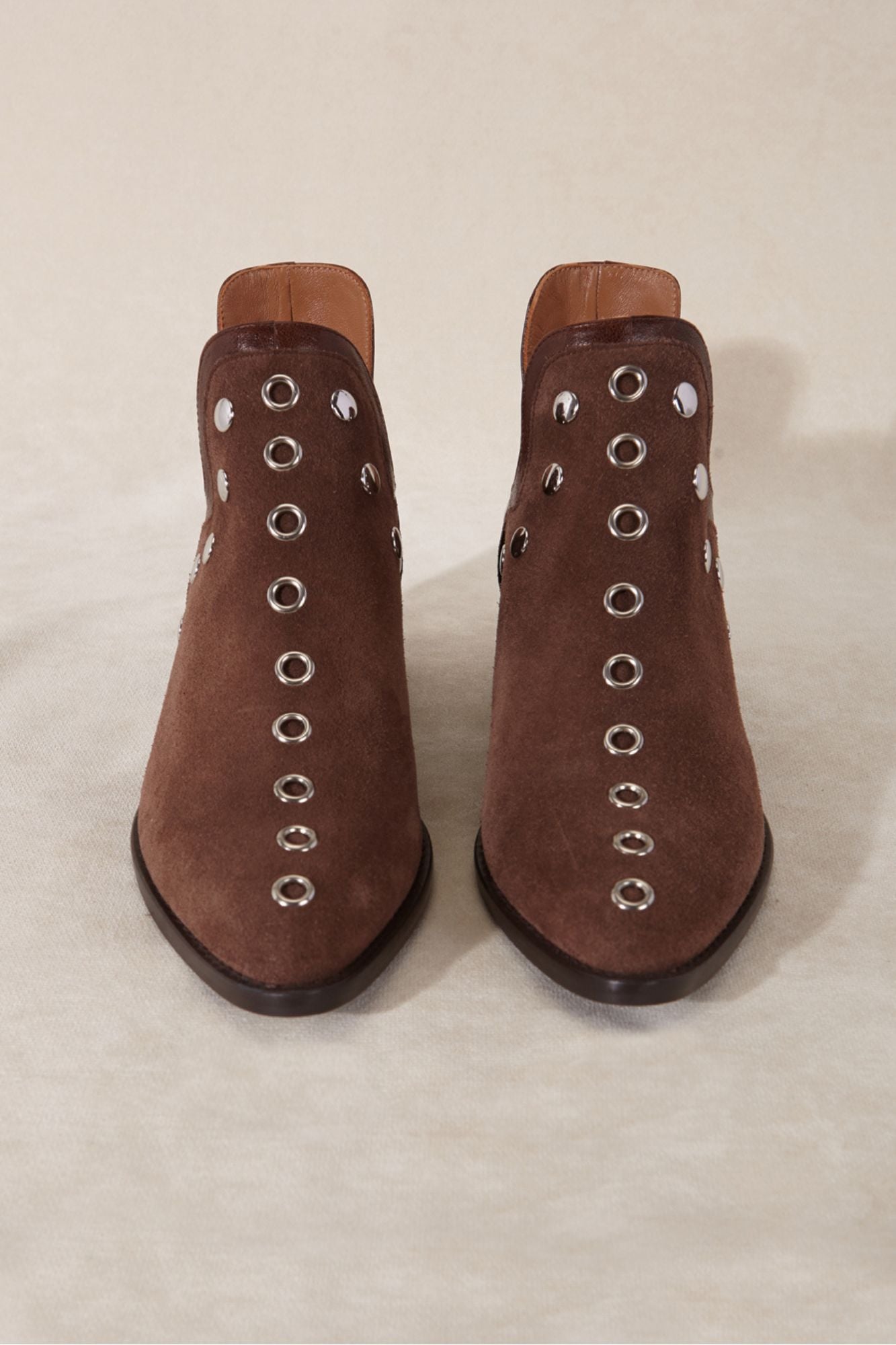 Brown split leather ankle boot with metallic studs
