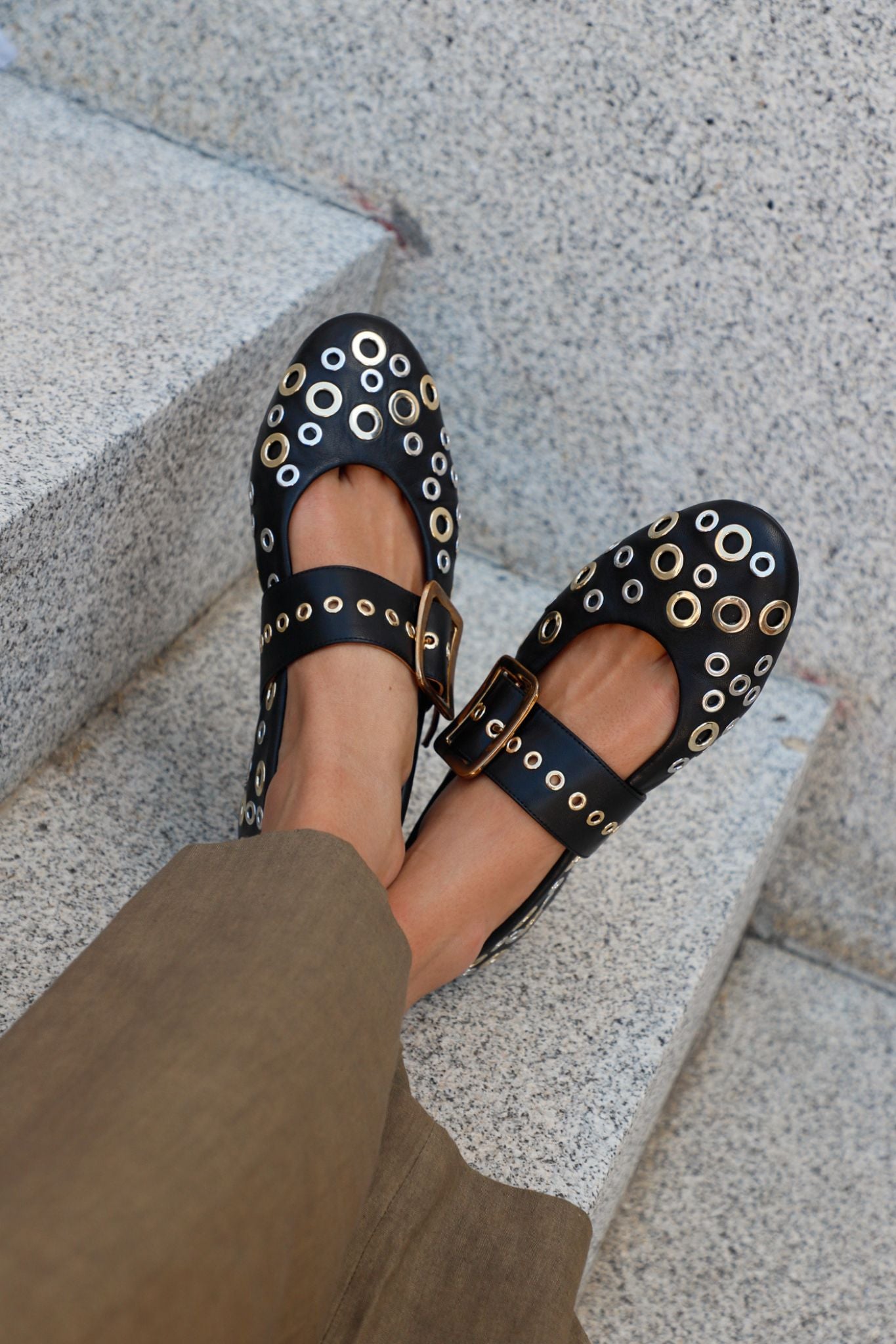 Black leather ballerinas with gold and silver studs. Micuir