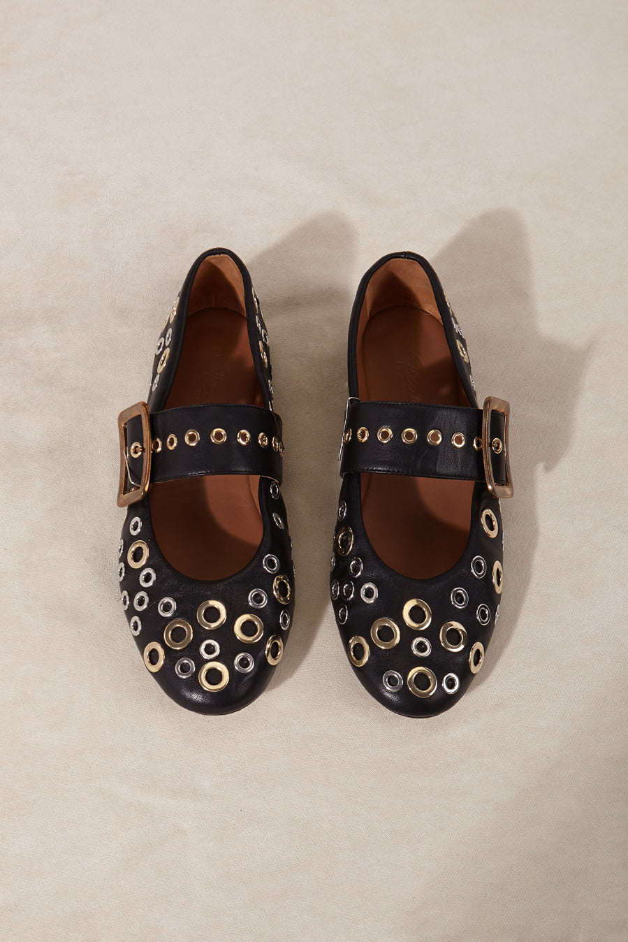 Black leather ballerinas made in Spain with studs.