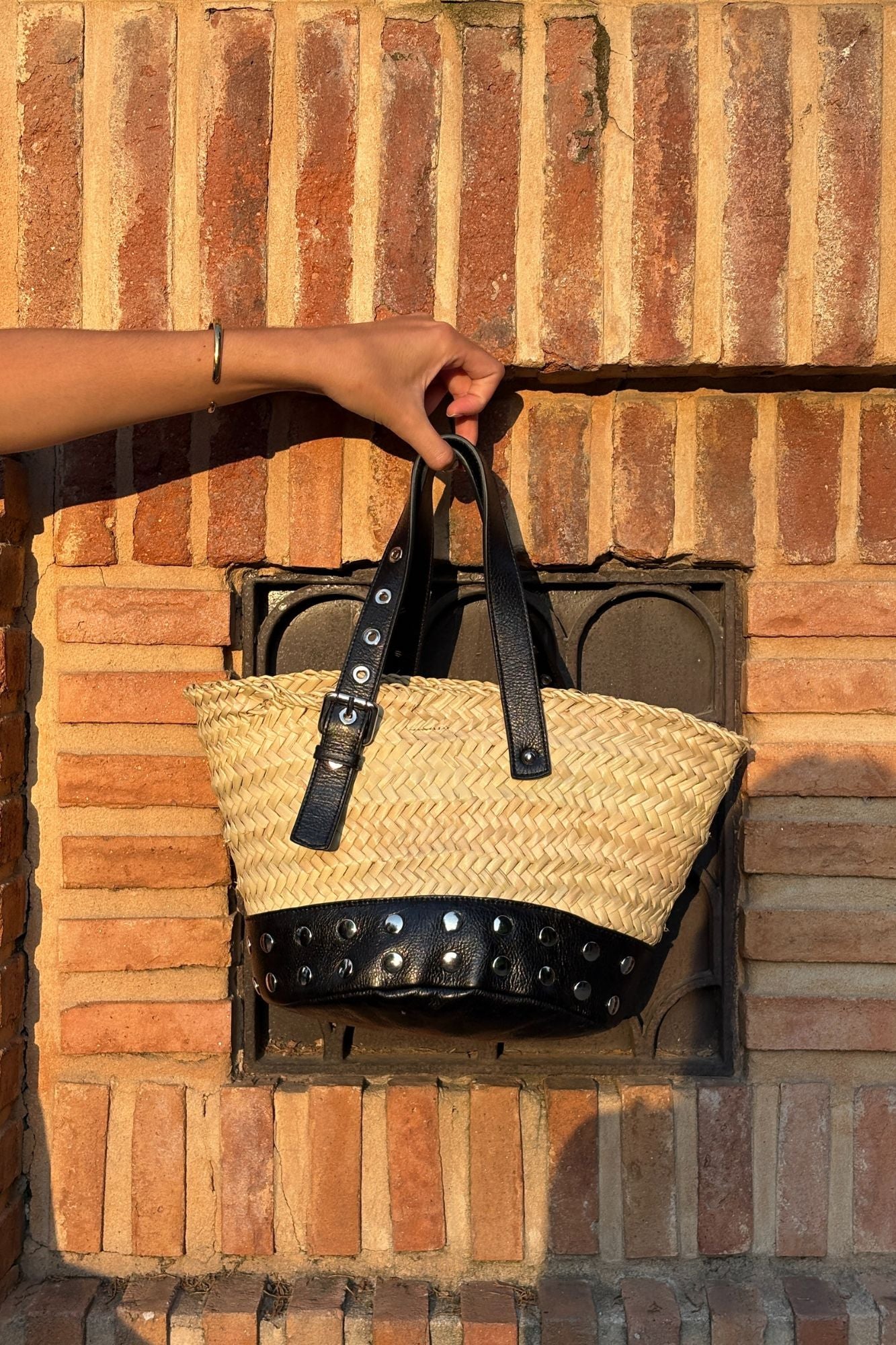 BLACK STUDDED PALM BUCKET BAG